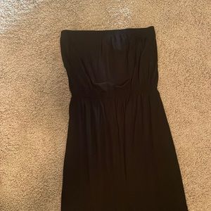 Black strapless maxi dress with cutout detail around lower legs